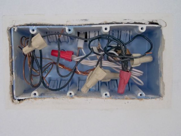 Electrician wiring a panel